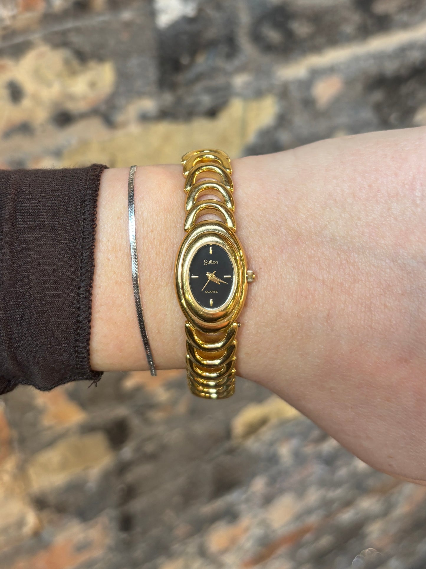 vintage dainty black dial half-moon watch