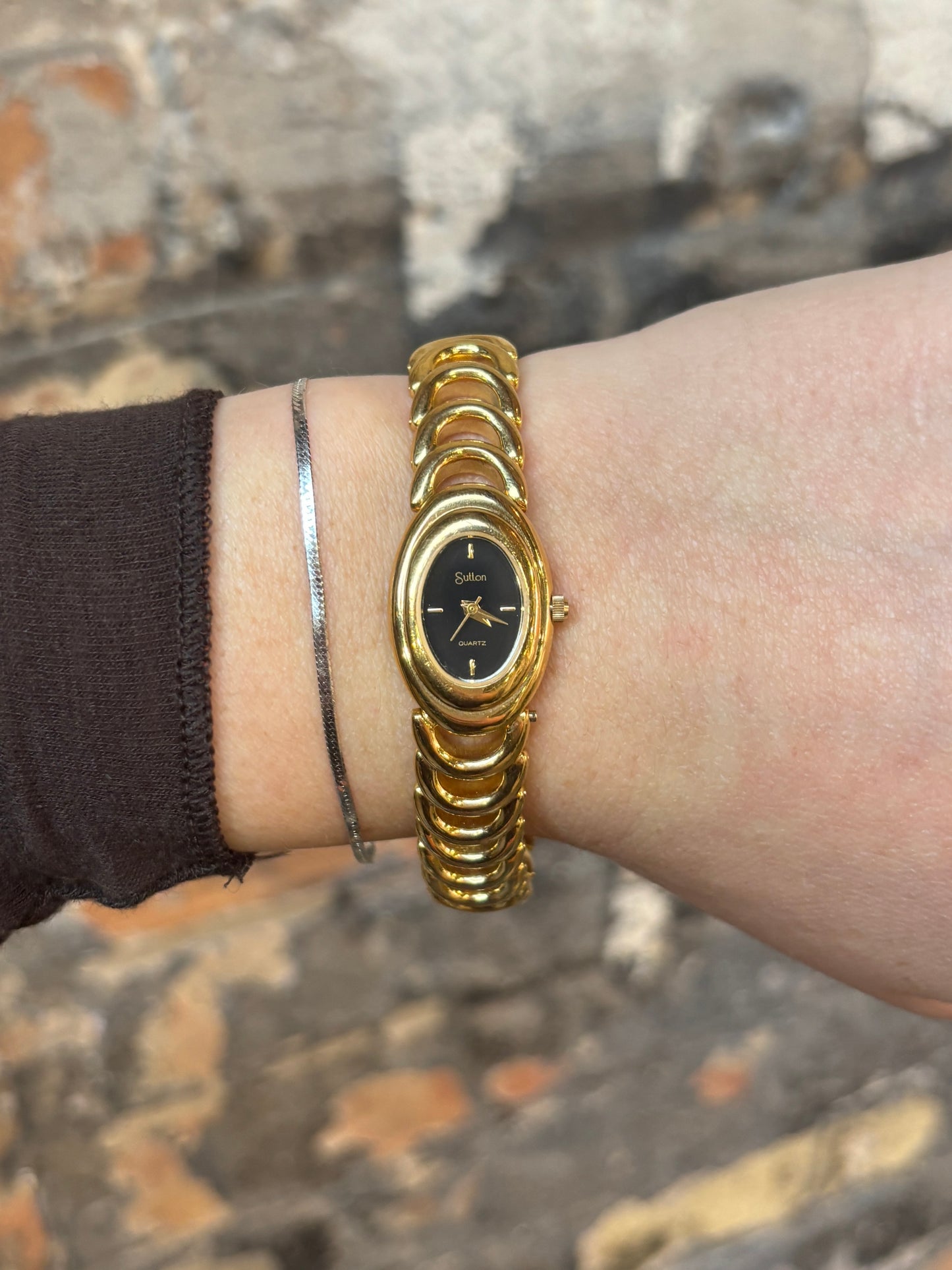 vintage dainty black dial half-moon watch